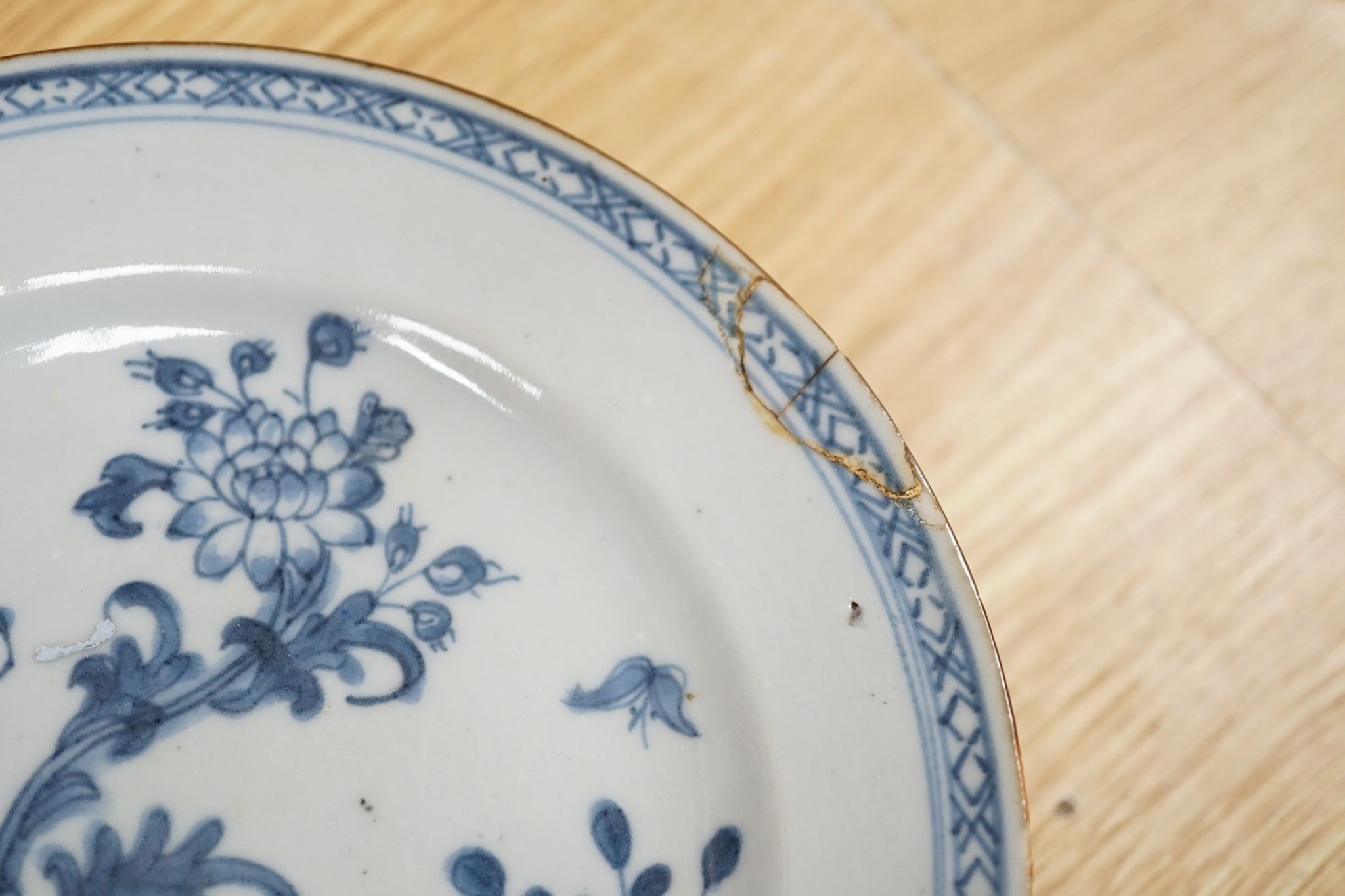 A Set of six 18th century Chinese export blue and white ‘bird in a cage’ small plates, 6.3 cm diameter and two pairs of 18th century Chinese export blue and white plates dishes, largest 23cm diam (10)